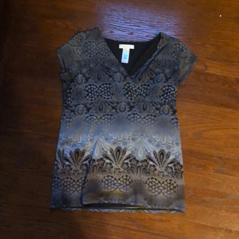 a tan and gray patterned shirt. worn once.